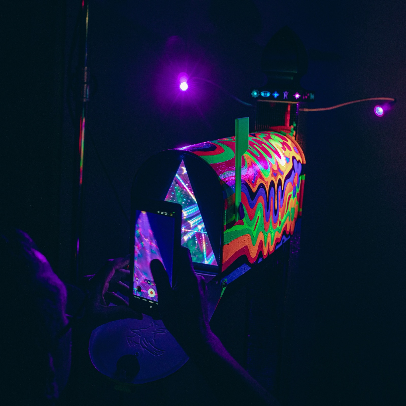 Interdimensional Mailbox – glowing kaleidoscope interior at night
